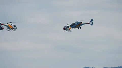 Patrulla Aspa three helicopter formation flight at Gijon air show Stock Footage 336456006