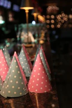 Patry hats on ceramic table. Close up Stock Photos