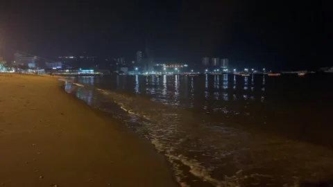 Pattaya beach front sandy view ocean wave at night. Tourism concept Video stock 255829620