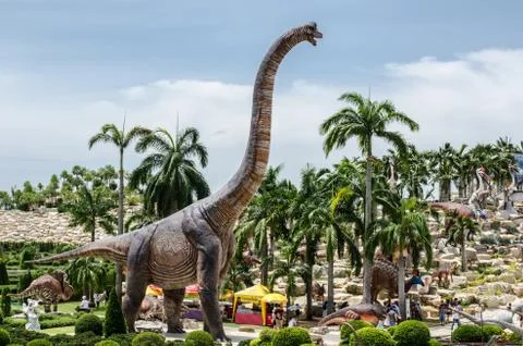 PATTAYA, THAILAND - AUGUST 13, 2017 : People visit dinosaur Valley at Nong No Stock Photos
