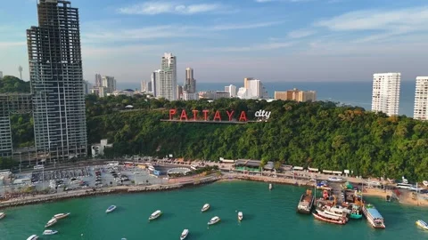 PATTAYA, THAILAND - DECEMBER 22 2024: Pattaya City famous sign stands on coastal Stock Footage 304838388