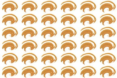 Pattern from abstract grained handful of golden coloured sand. Stock Photos