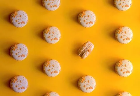 Pattern of almond macaroons on a bright yellow background Stock Photos