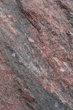 Pattern and texture of natural untreated granite layers. stone surface for ba Stock Photos