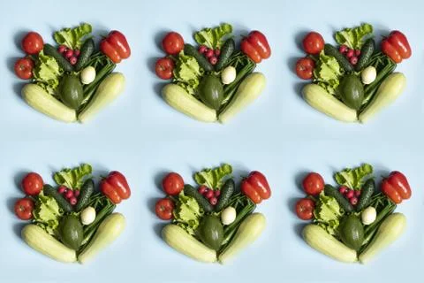 Pattern assortment of fresh green red organic vegetables on a blue background Stock Photos