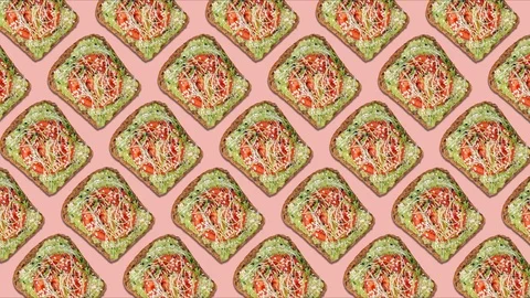Pattern of avocado toasts with tomato slice, sesame seeds and onion sprouts. Stock Footage 129499232
