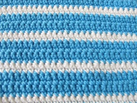 Pattern background from single crochet stitch in white and blue Stock Photos