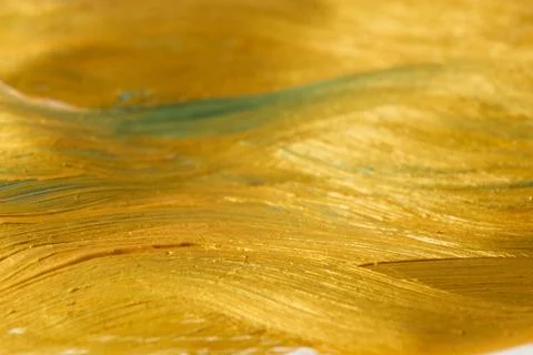 Pattern, background, texture of gold color with horizontal waves and stripes. Stock Photos