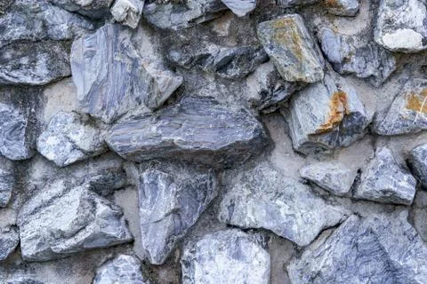 Pattern background wall made of stone and cement. Stock Photos