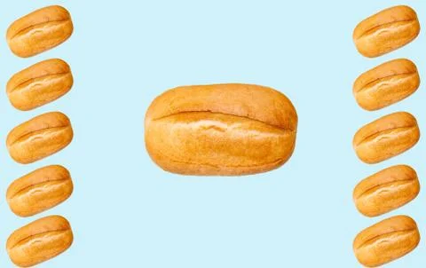 Pattern with a baked loaf on a blue background. Baguette. Stock Photos