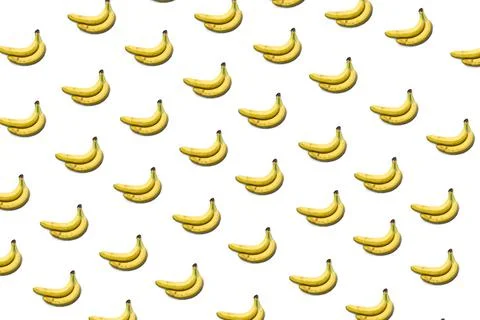 A pattern of bananas on a white background, a bunch of bananas. Stock Photos