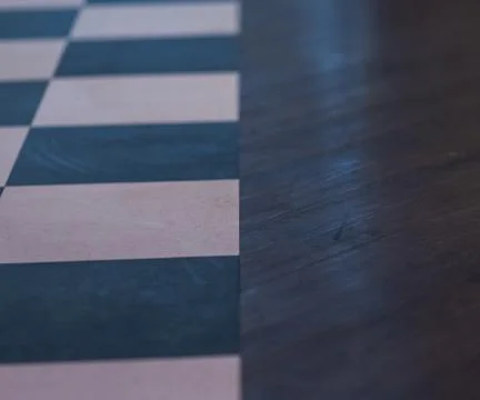 Pattern from barber floor - Blue and white tiles next to polish wood Stock Photos