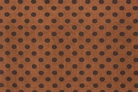 Pattern with big black polka dots on a brown use a background. Stock Photos