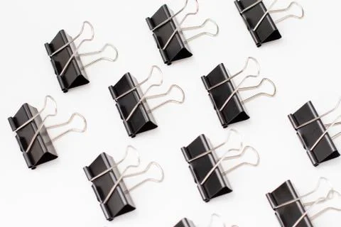 Pattern of binder clips on white background Stock Photos