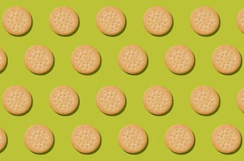 Pattern from biscuits on an olive background. Abstract background Stock Photos
