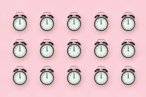 Pattern with black alarm clock on pink background. Minimal style Top view Tem Stock Photos
