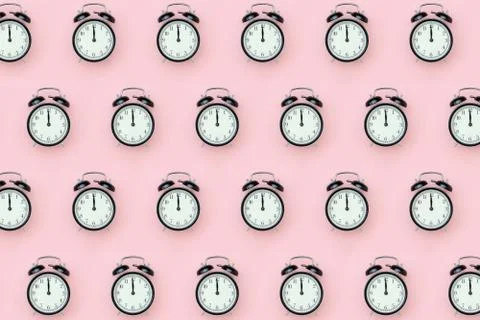 Pattern with black alarm clock on pink background. Minimal style Top view Tem Stock Photos