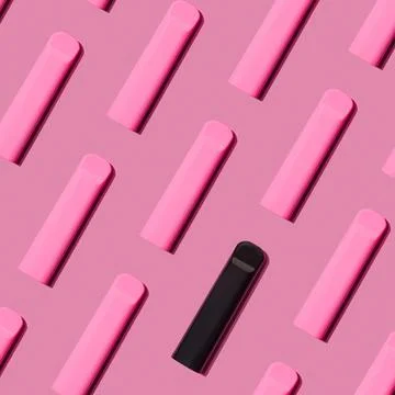 Pattern black and rose pod vape in background Stock Photos
