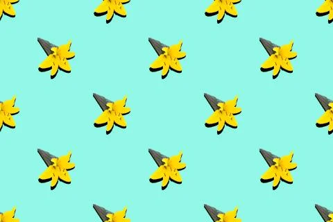 Pattern black ice cream cone with yellow lily flower on a blue background.. Stock Photos