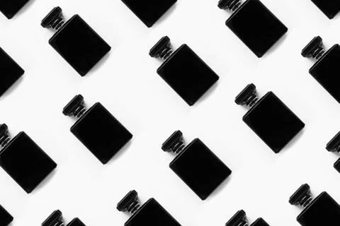 Pattern of black perfume bottles isolated on white background. Stock-Illustration