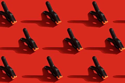 Pattern of black pins on red background Stock Photos
