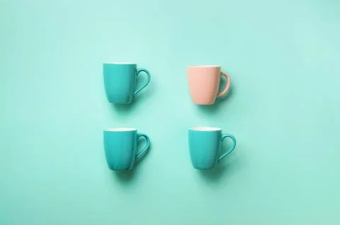 Pattern from blue cups over blue background. Birthday party celebration, baby Stock Photos