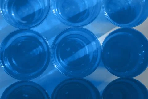 Pattern of blue disposable plastic cups. Trend of 2020 color Stock Photos