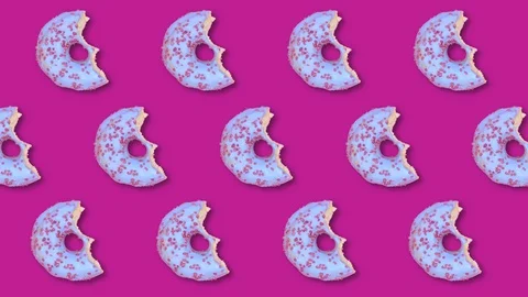 Pattern with blue donut, disappearing bite by bite. Creative food concept Stock Footage 128923139