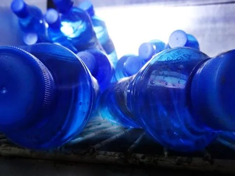Pattern of blue empty bottles Stock Photos