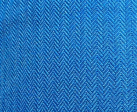 Pattern of blue fabric close-up with triangular shaped stitching 스톡 사진