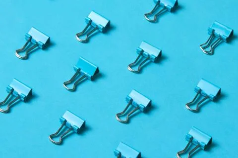 Pattern of blue metalic paper clips Stock Photos