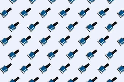 Pattern with blue nail polish bottles on white background Stock Illustration