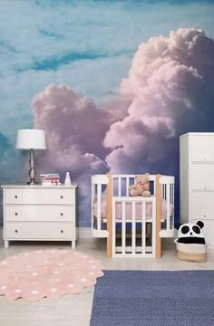Pattern of blue sky with clouds on wallpaper in furnished baby room. Beauti.. Stock Photos