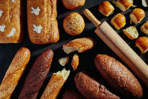 Pattern of bread. Bread assortment: baguettes, buns, loaves, dark and light Stock Photos