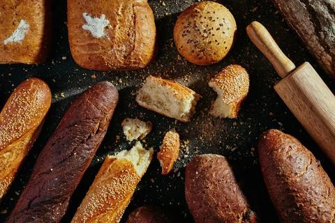 Pattern of bread. Bread assortment: baguettes, buns, loaves, dark and light Stock Photos