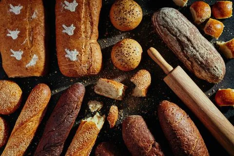 Pattern of bread. Bread assortment: baguettes, buns, loaves, dark and light Stock Photos