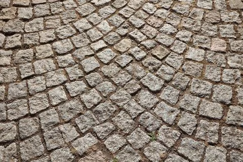 Pattern bricks pavement closeup old european road of stones and bricks Stock Photos