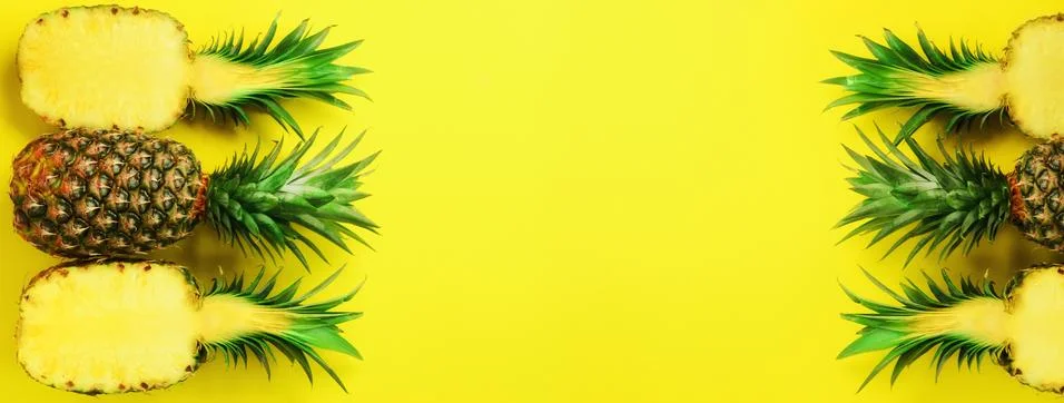 Pattern with bright pineapples on blue background. Top View. Copy Space. Minimal Stock Photos