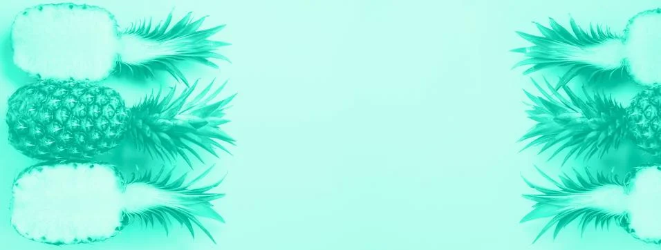 Pattern with bright pineapples on mint color background. Top View. Trendy green Stock Photos