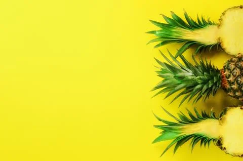 Pattern with bright pineapples on yellow background. Top View. Copy Space Stock Photos