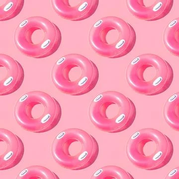 Pattern of bright pink inflatable rubber circles on a pale pink background Stock Photos
