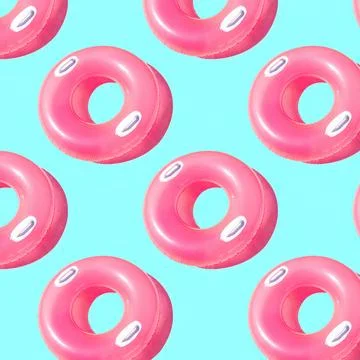 Pattern of bright pink inflatable rubber circles on a pale blue background Stock Photos