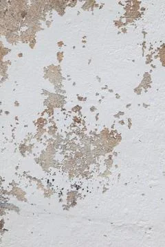 Pattern of broken stucco and paint on wall Stock Photos
