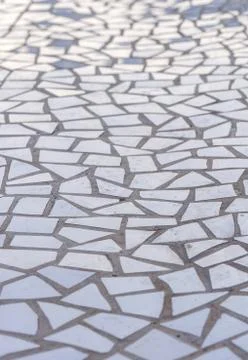 Pattern of broken white tiles, mosaic, trencadis, breakable, perspective view Stock Photos