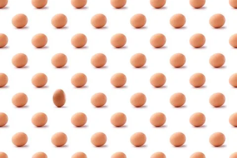 Pattern of brown eggs on white background Stock Photos