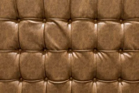 Pattern brown leather sofa background. Stock Photos