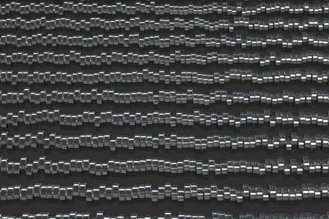Pattern of brushed metal cylinder tablets on black background Illustrazione stock