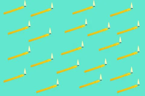 Pattern with a burning candle on a blue background. Foto stock