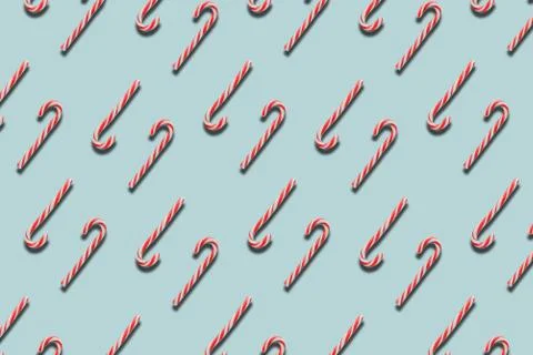 Pattern candy canes on blue background, striped lollipop, Christmas compositi Foto stock