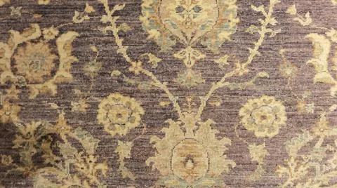 Pattern on the carpet in gray and beige tones Stock Photos